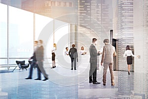People in an elevator hall, toned