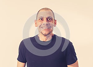 People emotions and facial expressions. Portrait of comic young man with funny crazy happy face