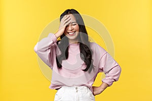 People emotions, lifestyle and fashion concept. Carefree happy asian girl in stylish outfit, laughing over something