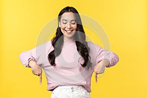 People emotions, lifestyle and fashion concept. Cheerful beautiful young 20s asian woman in stylish outfit introduce new