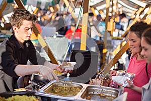 People enjoing outdoor street food festival in Ljubljana, Slovenia.