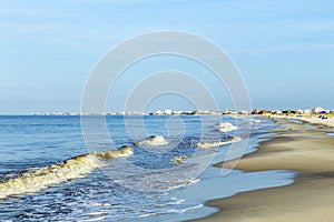 People enjoy the beautiful beach in late afternoon at Dauphin I