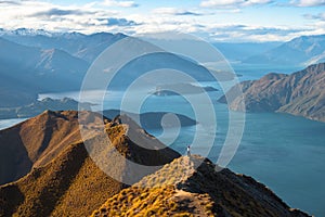 People enjoy with a beautiful landscape of the mountains and Lake Wanaka. Roys Peak Track, South Island, New Zealand. I