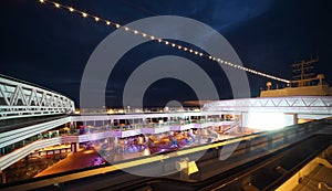People enjoy night party on deck of cruise ship