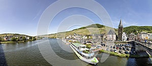 People enjoy the river cruise on river Moselle with view to old