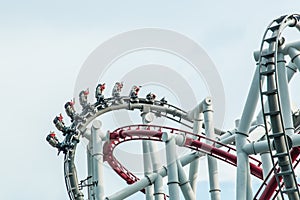 People enjoy Roller coaster on sky background view