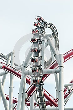 People enjoy Roller coaster on sky background view
