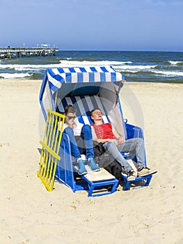 People enjoy sunbath in the roofed