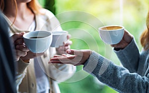 People enjoyed talking and drinking coffee together photo