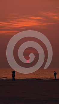 People Enjoying Beautiful Sunset at the Beach, Goa India