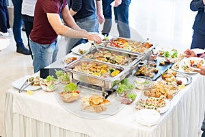 People enjoying buffet meal at the table