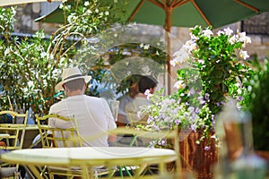 People enjoying drinks in cafe on a hot summer day