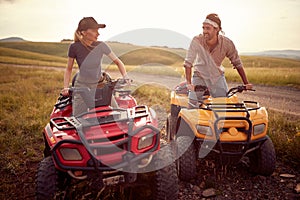 People enjoying extreme riding.Young couple enjoying a quad  vehicle photo