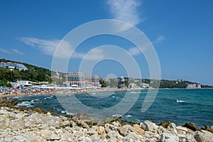 People enjoying the hot weather, beach fun,  - holiday destination with hotels at the beach, summertime season