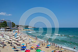 People enjoying the hot weather, beach fun,  - holiday destination with hotels at the beach, summertime season