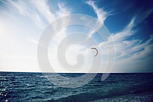 People enjoying kitesurfing on clear tropical water