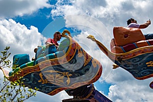 People enjoying The Magic Carpets of Aladdin sign in Magic Kingdom at Walt Disney World  1