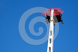 People enjoying ride on free fall attraction in  lunapark