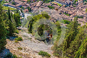 People are enjoying ride at Funivia Colle Eletto in Gubbio, Ital photo