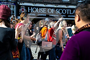 People enjoying a silent disco at The Edinburgh Fringe Festival 2018 on The Royal Mile
