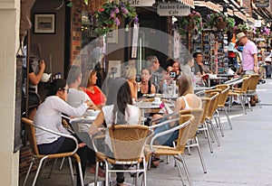 People enjoy at a cosy terrace in London Court, Perth, Australia