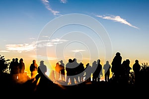 People enjoys the sunrise on the top of Merbabu volcano in Java in Indonesia