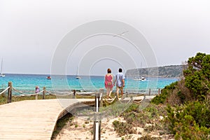 People in Es Calo de Sant Agusti fishing village on the island of Formentera in times of COVID19