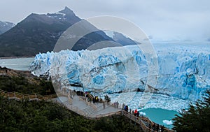 People on excursion at glacier Perito Moreno in Patagonia, Argentina