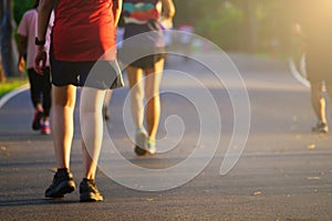 People exercise jogging running and walking on pathway at outdoors park.