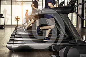 people exercise running on treadmill in gym