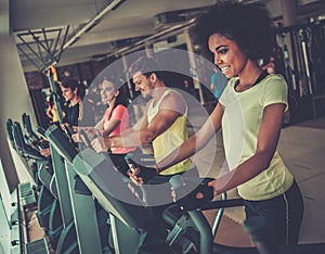 People exercising on a cardio training machines