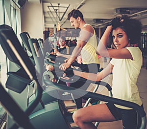 People exercising on a cardio training machines