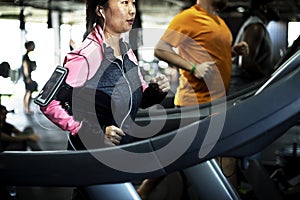 People exercising at fitness gym