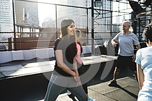 People exercising at fitness gym