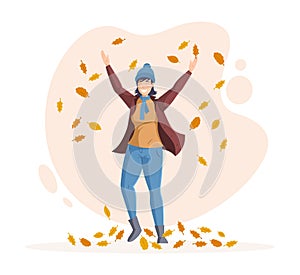 People in fall, enjoying autumn activity. Happy girl is jumping and throwing playing autumn leaves up. Fall and flying of leaves