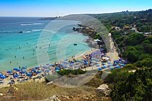 People at the famous beach of Konnos Bay Beach, Ayia Napa. Famagusta District, Cyprus. Best beaches of Cyprus - Konnos