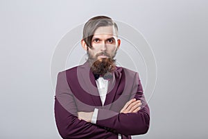 People, fashion and style concept - close-up portrait of young hipster on grey background