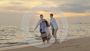 People of father, mother, children son and daughter family of four holding hands