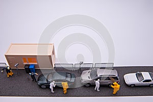People figurines and model corona car test station