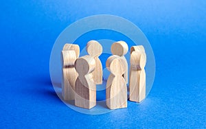 People figurines stand in a circle. discussion, cooperation. Employees briefing. Organization of work and processes. Meeting