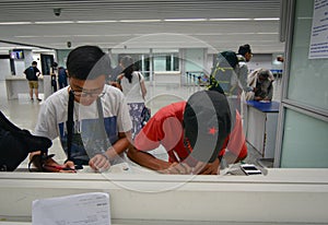 People fill the form paper at airport in Kolkata, India