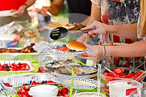 People at a Summer Potluck Picnic photo