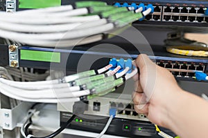 People fix core switch in network room