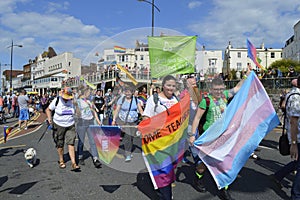 People with flags and banners join in the colourful Margate Gay pride Parade