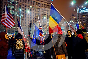 People with flags protesting against corruption, Bucharest, Romania
