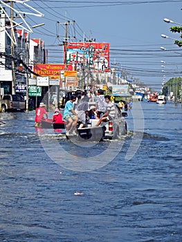 People in a Flooded Road