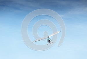 People flying in the powered hang glider