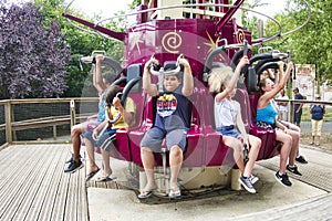 People free falling from tower ride at amusement park. Famous adrenaline attraction