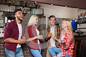 People Friends Drinking Orange Juice Talking Laughing Sitting At Bar Counter, Mix Race Man And Woman Couple