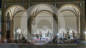 People in front of the Loggia dei Lanzi at Piazza della Signoria Square timelapse. Florence, Italy photo